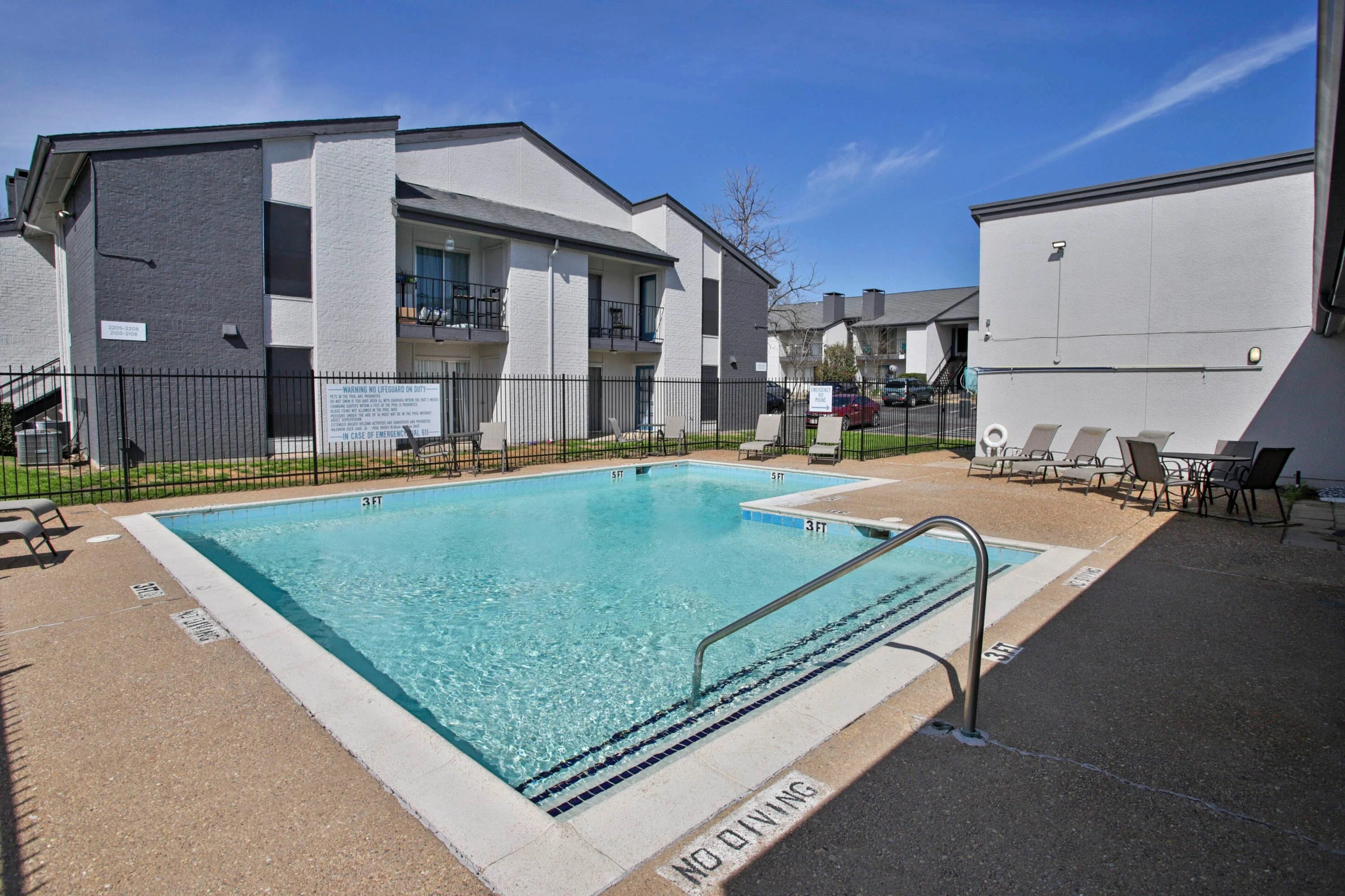 Poolside sundeck and lounge seating in Sherman Texas apartment community